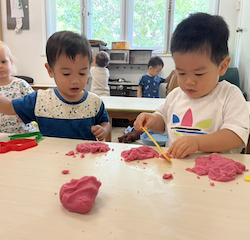 Mateo and Wesley cutting the dough into small bits!
