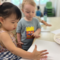 Maya doing some hand printing with paint!