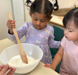 Nysha giving it a go at mixing the flour and salt!