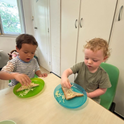 Rowan and Arthur sprinkling cheese like snow on toast!