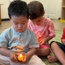 Wesley lighting up his tea light candle.