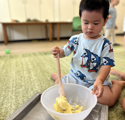 Wesley working hard on mixing the sugar and butter!