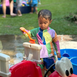 Mateo giving a good scrub to his car.