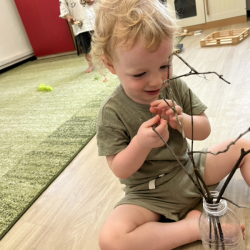 Arthur helping to create our mini Easter tree!