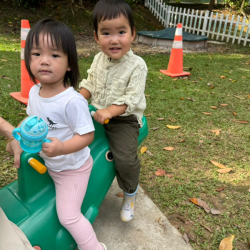 Cara and Celene having fun outdoors on the seesaw!