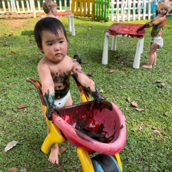 Cara delighting in messy play!.