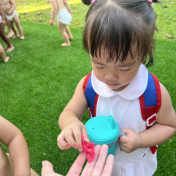 Celene exploring the texture of cooked pasta!