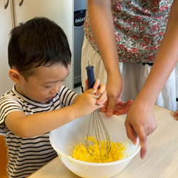 Daniel using his strength to cream the soften butter!