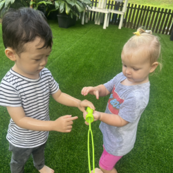 Eleanor and Daniel taking turns with the bubbles wand!