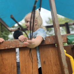 Eleanor gathering sticks to make a house!