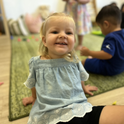 Eleanor pulling off a happy face imitating Gerald’s happy emotions.