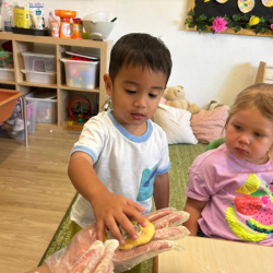 Mateo shaping his cookie dough.