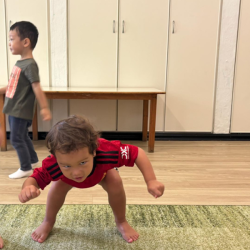 Rowan pretending to be a jet plane during music and movement!