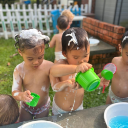 Cara enjoying herself outdoors during messy sensory play🤪