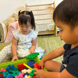 Celene having a go with waffle blocks!