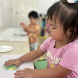 Celene watching the colours getting transferred onto the paper!