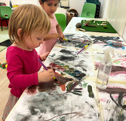 Edwina having fun with painting!