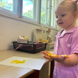 Eleanor admiring her hand print