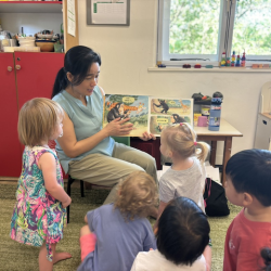 Everyone enjoying a story about monkeys and elephants!