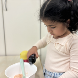 Kai adding some essential oils into the salt scrub mixture!