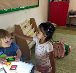 Nysha pretending to pass on her phone to Edwina!